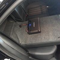 Rockford amplifier mounted on back of rear seat