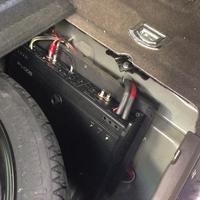 Hidden amp near spare tire