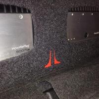 JL Audio 500/1v2 amplifiers in rear seat of Dodge Challenger