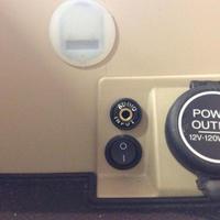 Power outlet, audio auxiliary input, and USB input custom installed inside console in Acura RL