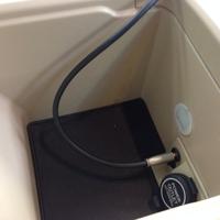 Display of inside center console with AUX cord plugged in, inside Acura RL, installed at Custom Sounds