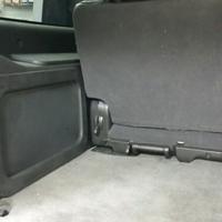 hidden behind factory paneling with grill cloth