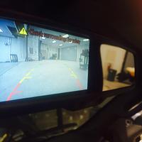 Replacement mirror with screen for camera