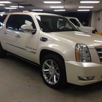 Side of custom white Cadillac Escalade