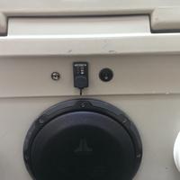 Display of speakers on side of custom Yeti Cooler